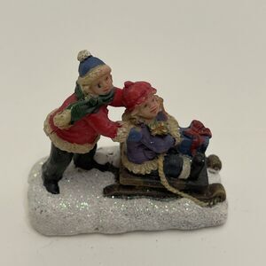 Celebrations Christmas Village Snowy 2 Kids Sledding 2 Inches Tall Glittery Snow